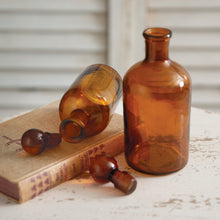Load image into Gallery viewer, Set of Two Amber Glass Bottles with Stoppers