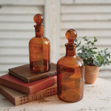 Load image into Gallery viewer, Set of Two Amber Glass Bottles with Stoppers